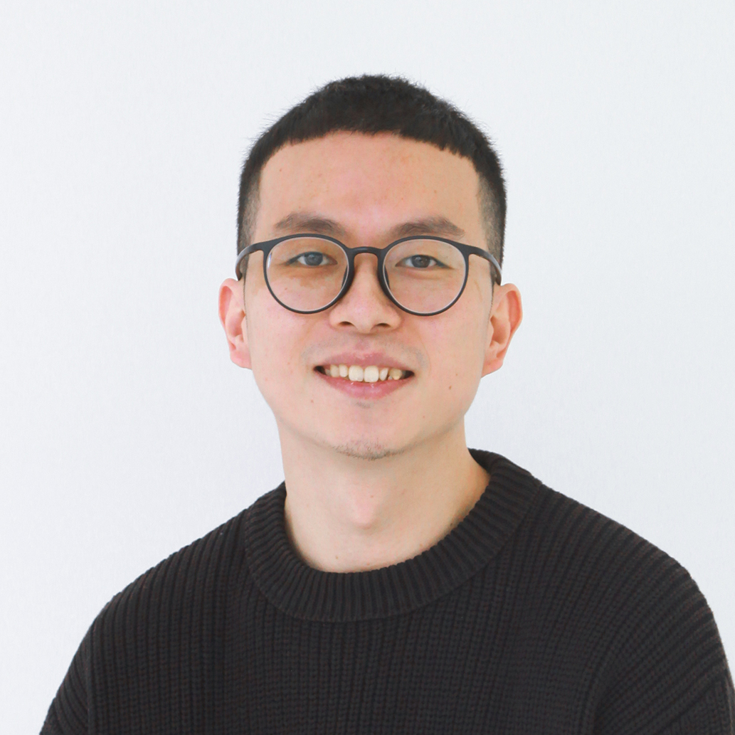 headshot of a young male wearing glasses